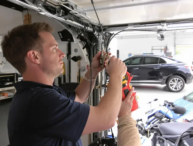 South Windsor Garage Door Repair safety certified technician performing cable replacement in South Windsor