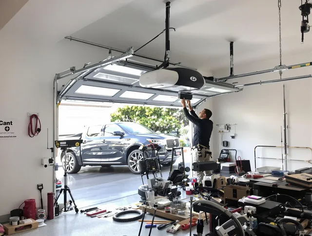 South Windsor Garage Door Repair specialist installing smart garage door opener system in South Windsor home